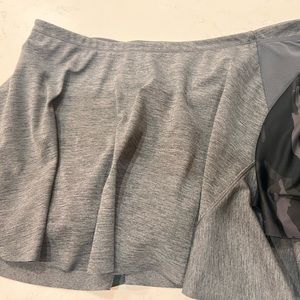 2 Athleta tennis skirts GUC and both size large. Grey and black camouflage